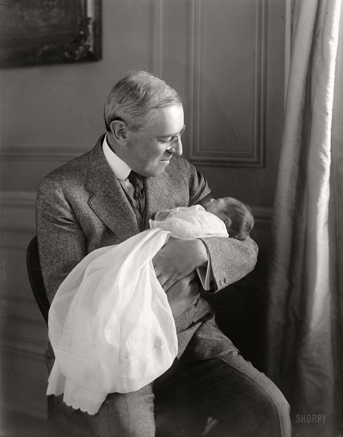 "Francis Sayre Jr., baby, with Woodrow Wilson." The President and new grandson in 1915, less than a year after the death of his wife Ellen. View full size.