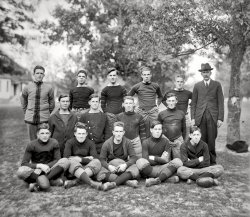 St. Mary's County, Maryland, circa 1920. "Charlotte Hall football." Cadets at the military academy.  Harris &amp; Ewing Collection glass negative. View full size.
Flat!That pigskin looks like it needs a pump-up.
Dr. DeathThey all look healthy enough. I wonder why the local undertaker was included in the shot.
Charlotte Hall&#039;s majordomoI like the Charlie Chaplin lookalike majordomo. I wonder if he was the coach?
Hair hair!That good looking cadet in the front row, second from the left has a luxurious head of thick, curly hair.  I wonder if he was able to keep it as he aged.  I starting losing mine in college. I hate him.
Taxi SquadI believe some of the lads here are currently vying for a back-up running back spot with the 2010 Washington Redskins. On another note, Sylvester Stallone was a  Charlotte Hall cadet circa 1961, although he graduated elsewhere.
Stalwart young menCharlotte Hall Military Academy was one of the oldest schools in Maryland, having been established by an act of the Maryland General Assembly and opening in 1774. The school was located on a 50-acre lot located near the historic Coole Springs of St.Mary's, which provided the water supply for the school and the village of the same name.  It looks like the faculty member in this picture might be Professor J.F. Coad, who is described in the school's history as a beloved faculty member and St. Mary's County native.  I had the privilege of knowing many people from this fine institution which dissolved in 1976 due to financial difficulties. Now there is a veterans home on the property although two of the historical buildings remain.
LookalikesI see Sean Penn (back row, far right, next to the undertaker), Jude Law (middle row, far left) and Clancy Brown, who played Capt. Hadley in The Shawshank Redemption (back row, far left).
(The Gallery, Harris + Ewing, Sports)