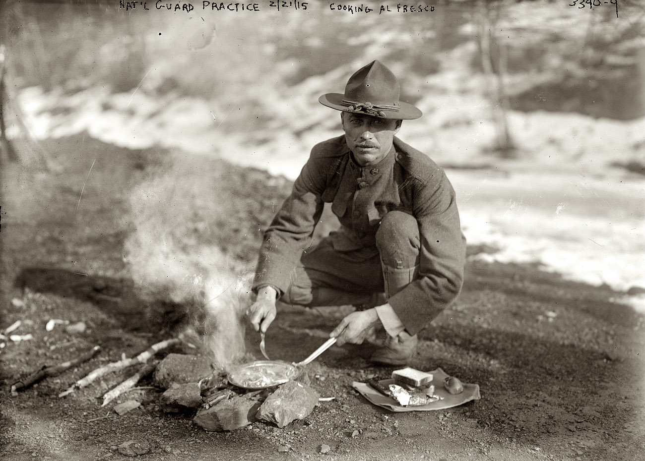 February 21, 1915. Peekskill, New York. "National Guard practice. Cooking alfresco." 5x7 glass negative, George Grantham Bain Collection. View full size.