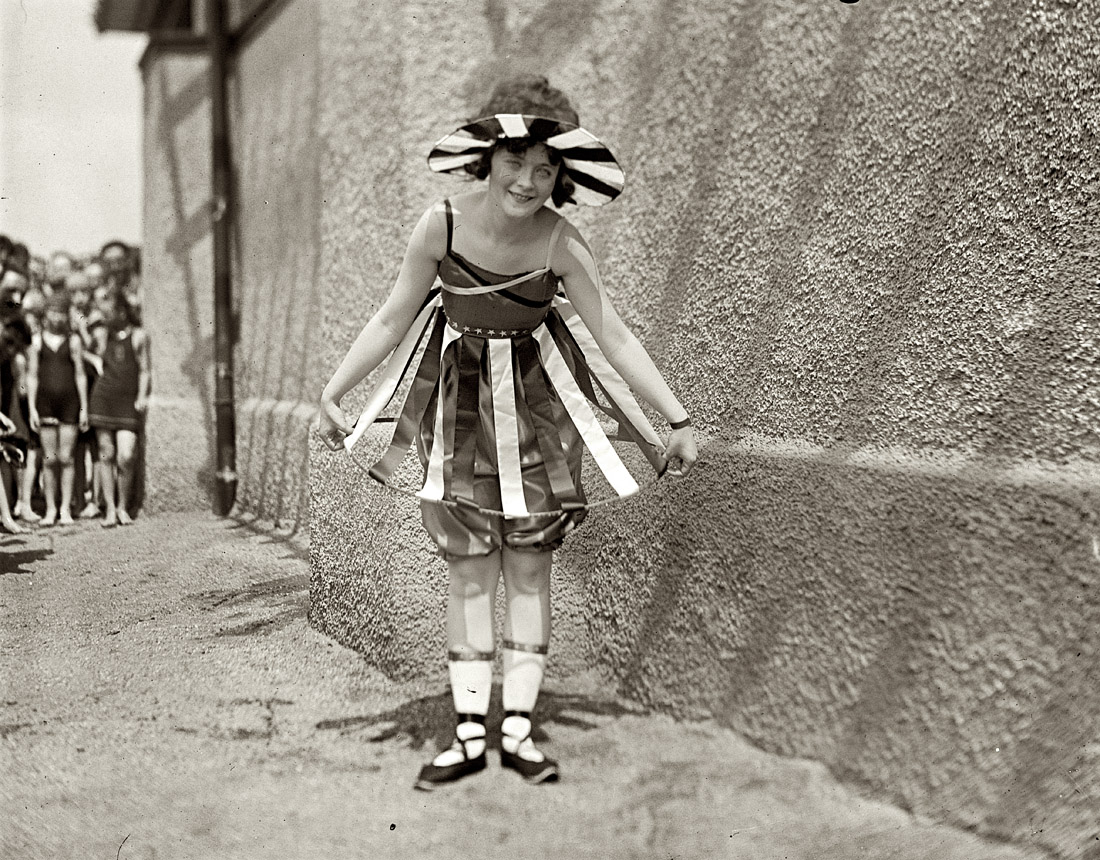 July 26, 1919. Washington, D.C. "Bathing beach parade." View full size. National Photo Company. Vertical stripes -- so flattering to a girl's figure.