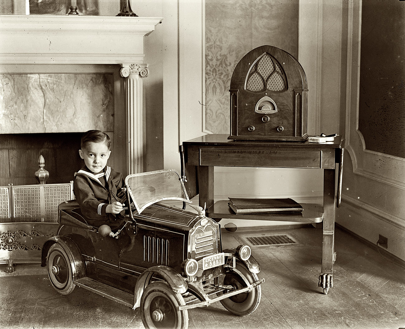 Washington, D.C., circa 1931. "Child seated in toy automobile." View full size. National Photo Company Collection glass negative. The radio: Atwater-Kent 84Q.