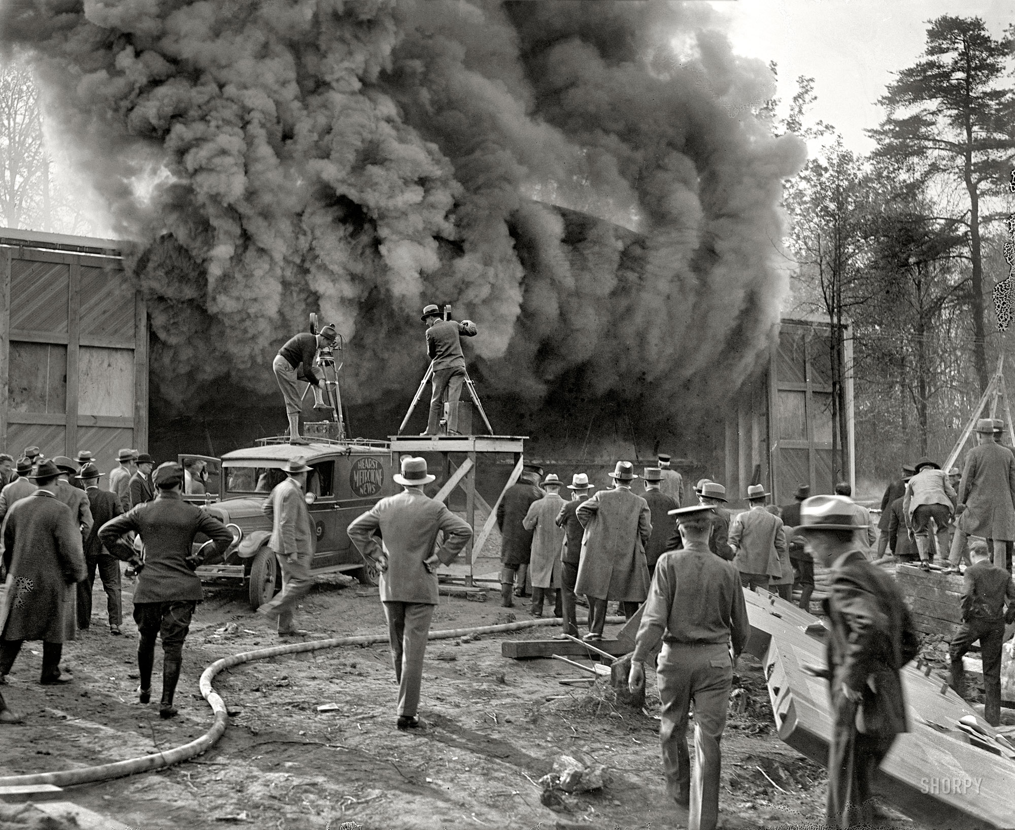 Washington, D.C., or vicinity circa 1928. "Photographing fire for newsreels." National Photo Company Collection glass negative. View full size.