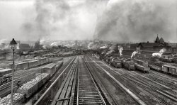 Scranton, Pennsylvania, circa 1900. "Delaware, Lackawanna, and Western Railroad yards," the two images Scranton: 1900 and Old King Coal: 1900 put together, using some cut & paste techniques. The difference is only one freight train, the smart observer Dave recognized the man in the white overalls, who seems now to have solved the "bilocation" problem! View full size.