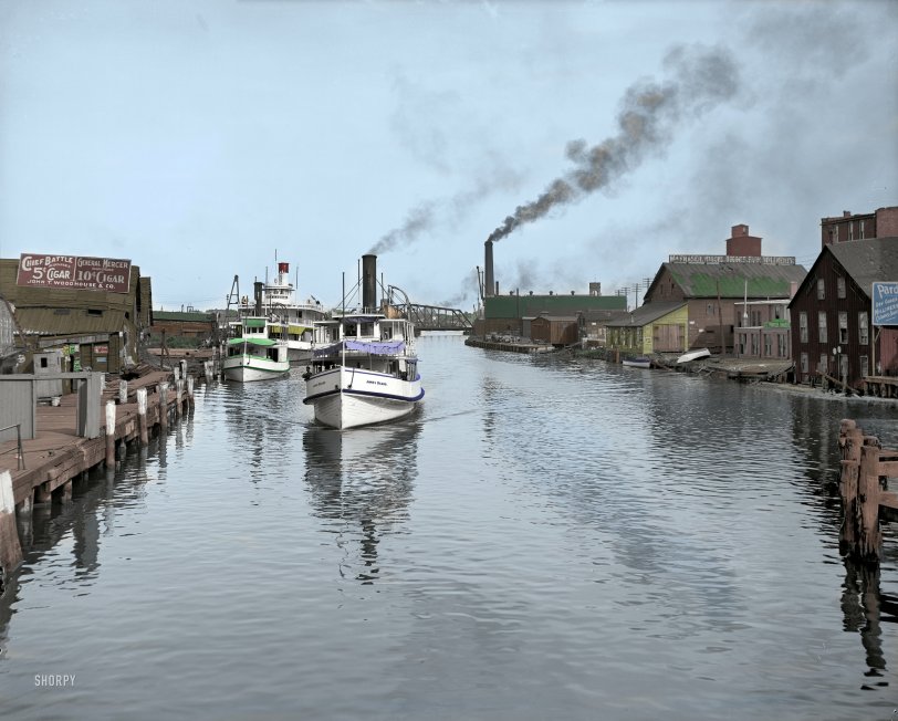 From this Shorpy original. Port Huron, Michigan 1905. The Black River takes you out to lake Huron. I see most of these buildings look like there ready to fall down. View full size.
