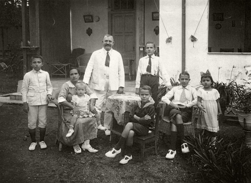1918 circa, Java, Dutch East Indies, a portrait of my father-in-law's parental family. My (late) father-in-law, Marinus Wennekes, is the boy in sailor suit, who is sitting prominently in the middle in front. He was born in 1912 in Magelang, Java, Dutch Indies. He is surrounded by his parents and siblings. The father, my wife's grandfather, was born in Tiel, The Netherlands, the rest were all born in the Dutch Indies. The father died during the war in the Dutch Indies, the rest of the family eventually moved out to The Netherlands after the emergence of Indonesia, when they were forced to choose Nationality: either Dutch or Indonesian.
