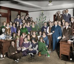 Another fine Shorpy picture colorized. View full size.
The Colors of ChristmasNice job, especially considering there are a lot of subjects to work with. But even in color, I still believe the woman standing with her right hand on the young lady's shoulder is Stan Laurel in drag.
NOW it feels like Xmas!Thank you SO much!
great jobI'm very impressed, I think you did a great job right down to the small detail stuff on the desk and tree, can I ask how long did it take you?
western electricI'm glad you all like it, thank you so much. This took me a little over 4 hrs to do.
(Colorized Photos)