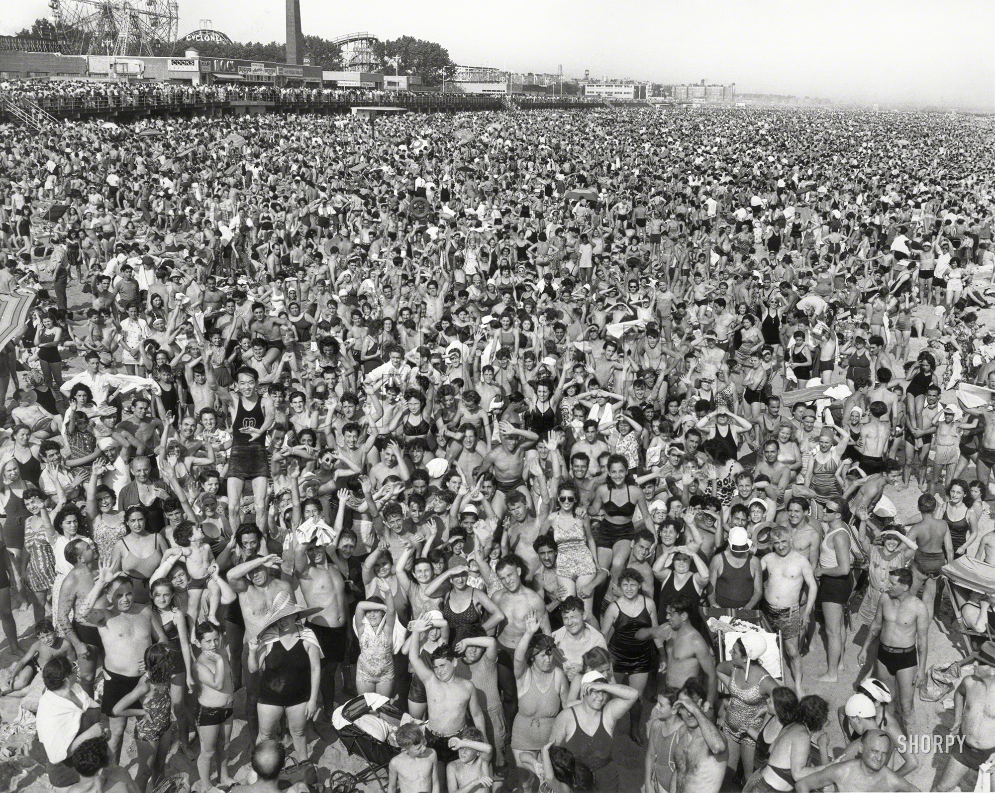 New York, 1940. "Crowd at Coney Island." Gelatin silver print by Arthur Fellig, the press photographer known as Weegee. View full size.
