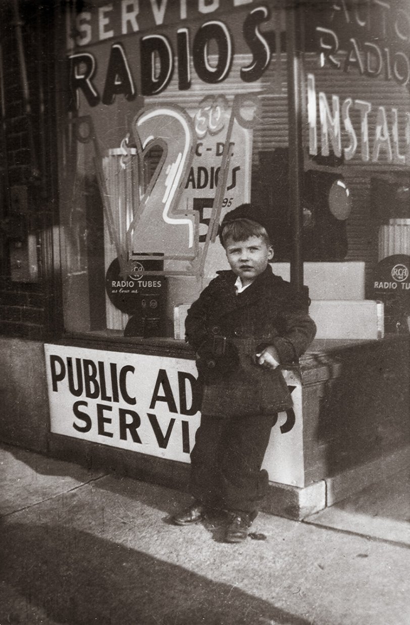 My dad at six years old. Taken at 14342 Kercheval in Detroit. My Grandpa Breen owned this radio store. The family lived in the upper flat. He was also a sign painter and did his own window signage. View full size.
