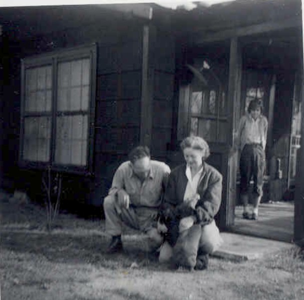 A 1943 photo of my grandparents at their house in Birmingham. The very weird girl standing on the porch is unknown and she gives me the creeps in this photo.