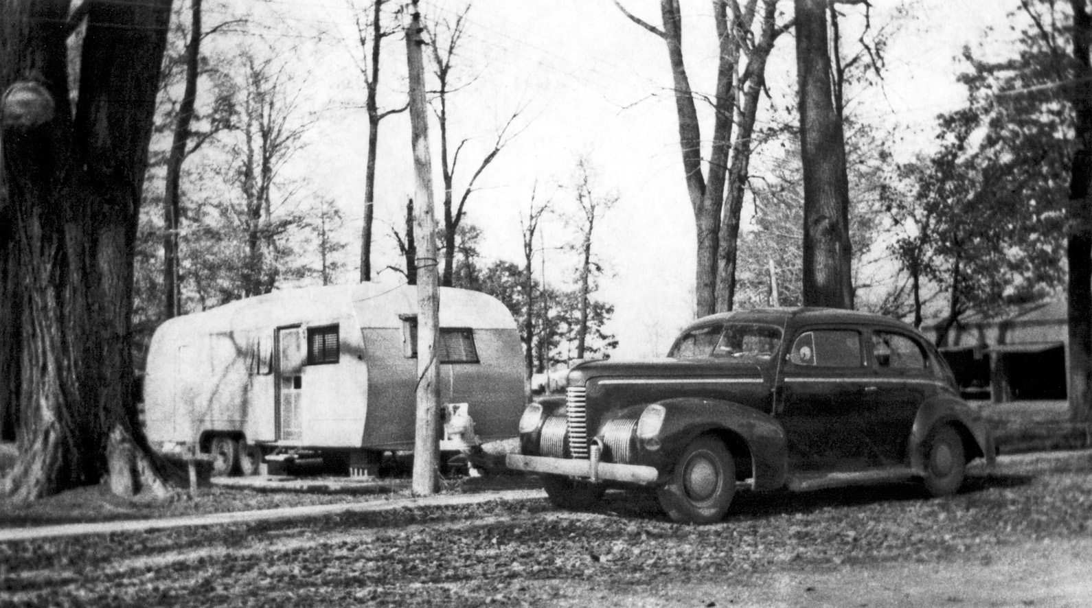 Flint, Michigan, 1947. Trailer park. Better weather than winter! Mother- and father-in-laws' trailer and auto. View full size.