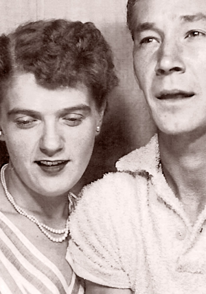 Mom and Dad - "Waiting for the Flash" as they read the instructions in a photo booth. Bernard and Dorothy Cliser, Las Vegas, Nevada, 1953. View full size.