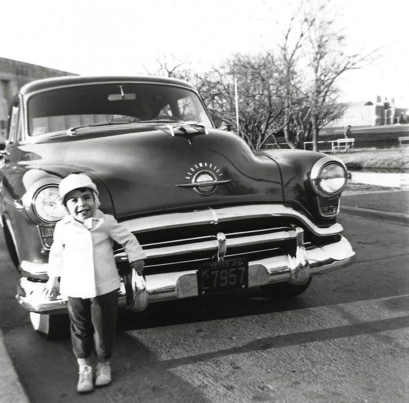 Dallas, Texas January 1953: Our brand new 1952 Oldsmobile 98 four-door sedan, powered by a "Rocket V8." Twelve years later I learned to drive in this behemoth and parallel parking was not fun. View full size.
