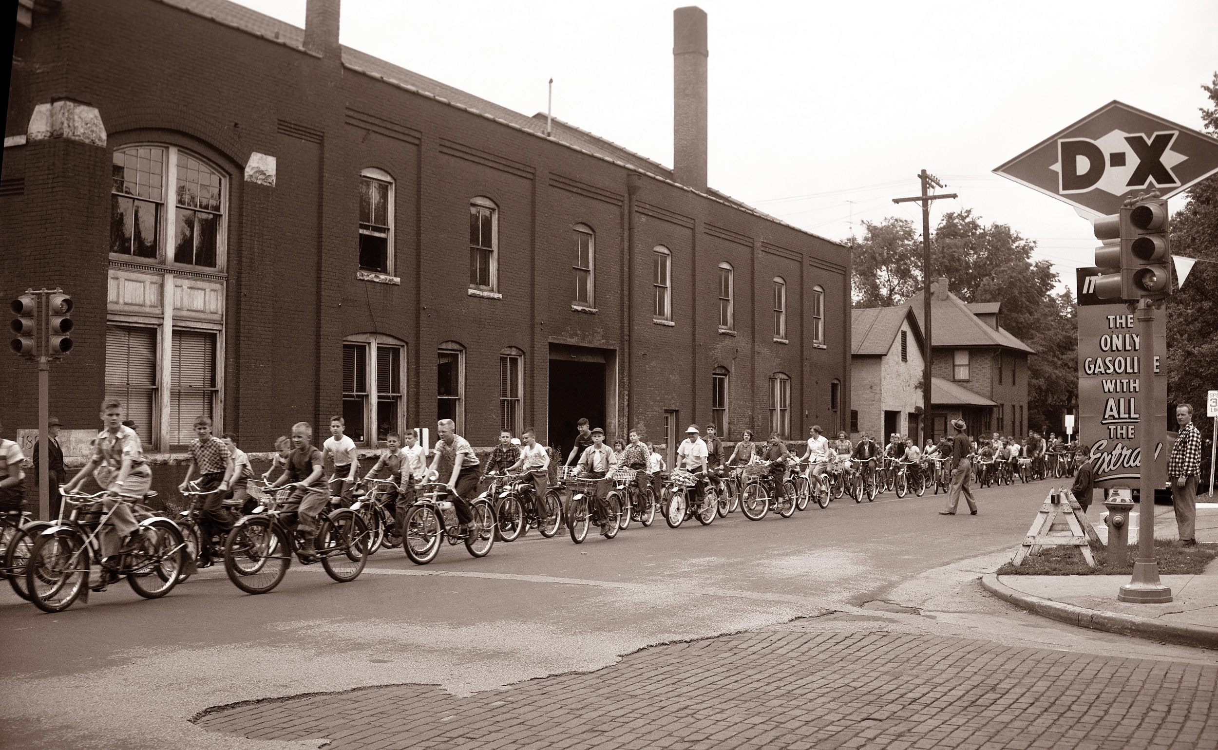 A companion photo to one posted earlier here, taken during a bicycle registration event in Lafayette, Indiana in 1954. Wally and The Beav are surely in there somewhere. View full size.