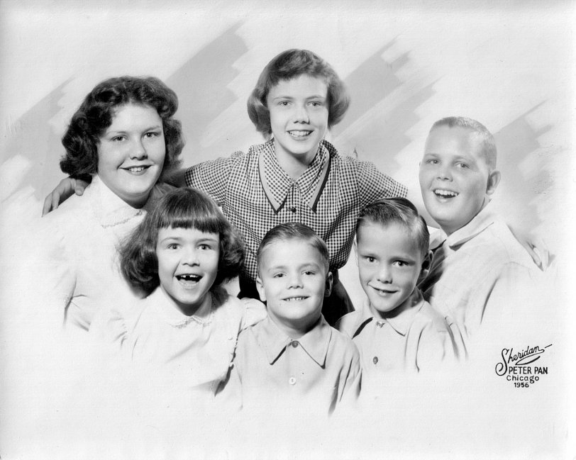 My mother, with her many brothers and sisters, taken by Sheridan-Peter Pan Studios in Chicago in 1956. My mom is the one with her mouth wide open. She was quite shy about her missing tooth, but the photographer made a face that made her laugh out loud and, subsequently, this was the best photo of the bunch. View full size.
