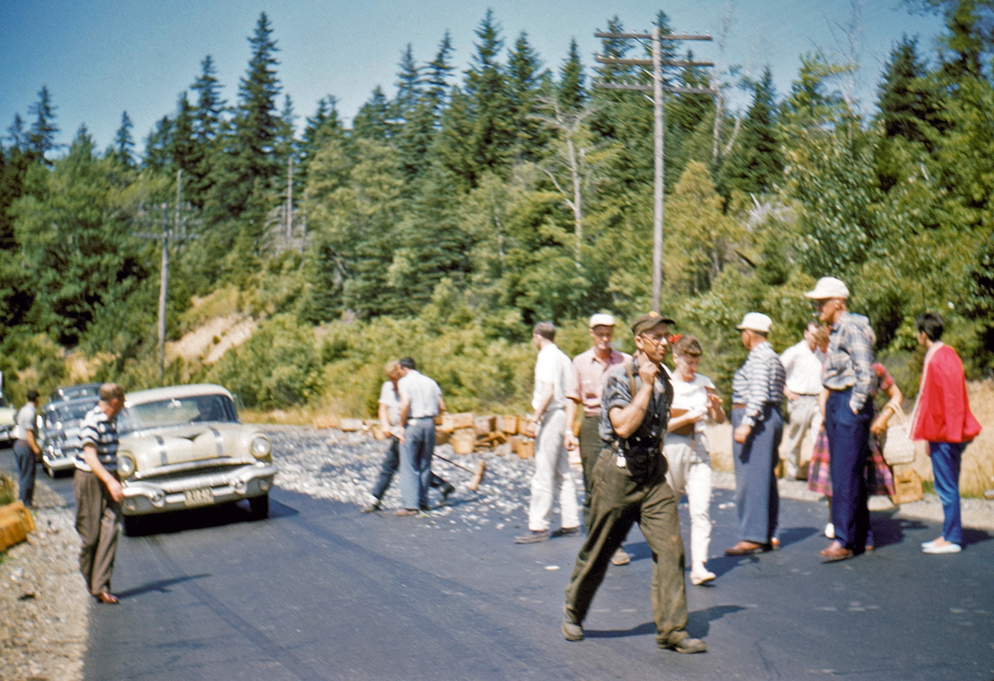 Taken 1958 in Maine. Can't quite tell if this is routine construction, a transit spill, or some kind of rockslide. View full size.