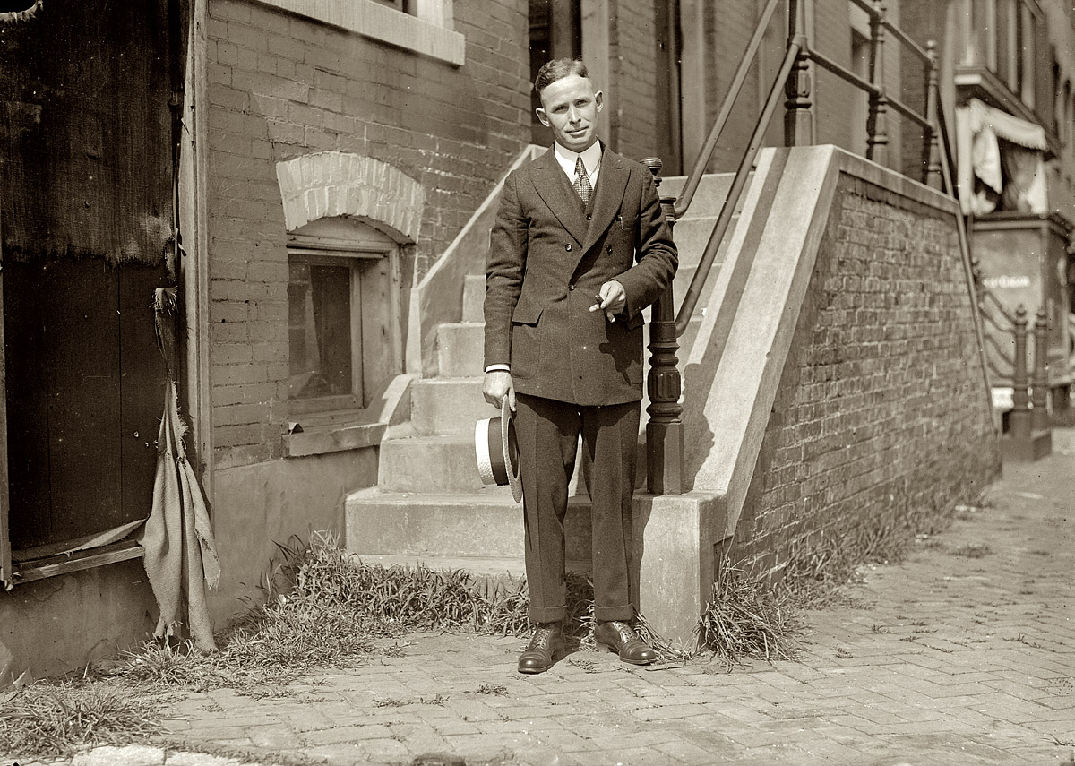 April 1, 1913. "Lloyd Davis, 125 Riverside Drive. Says 22 yrs. old but it is doubtful. Quit schooling after four years in New Haven to take job in Lower Manhattan. Evidently a newsie. Talks in gibberish: 'I sell paper on the Street. Bonds, convertible debentures, securities.' Smokes, visits saloons. Goes to houses in the District: Goldman Sachs, J.P. Morgan. Makes fifty dollars a day." Photo and caption by Lewis Wickes Hine. View full size.