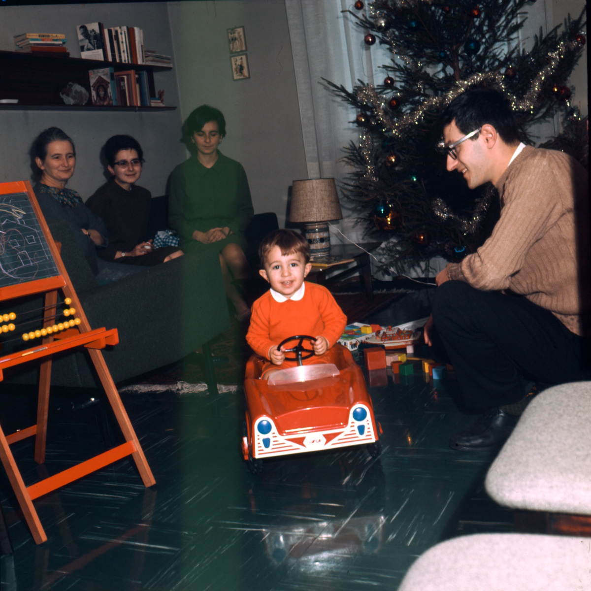 This is a scan from an original Kodachrome 6X taken on Christmas 1967. That is me in the new car, my Father, my Mom, aunt and grandma. View full size.