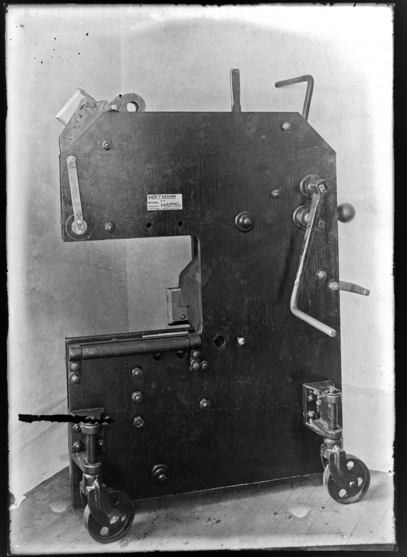 An image of the Model 1HA metal cutting and coping machine co-developed by my Grandfather Albert W. Happel.  The glass negative suffered a gouge in the lower left corner. View full size.
The Model 1HA Patent was filed on  May 15, 1911 and patent #1044177 was issued on Nov 12, 1912. This is the oldest patent carrying my grandfather's name.  It can be seen here.
