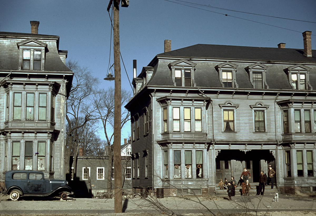 Children in the tenement district, Brockton, Massachusetts. December 1940. Photograph by Jack Delano. View full size. These duplexes must have been fairly grand when they were new, probably around the turn of the century. They look like the house where Granny and Tweety Bird lived. Are they still there?