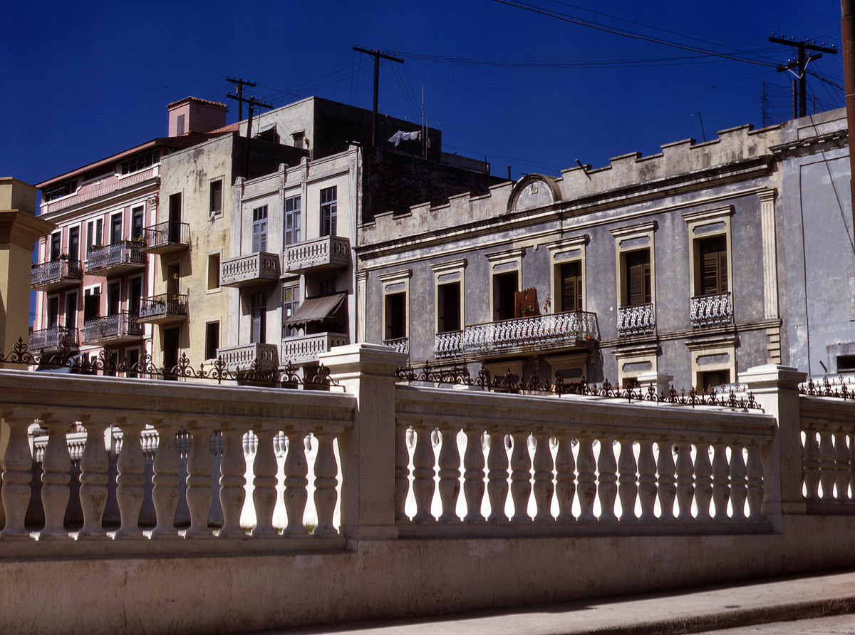 December 1941. San Juan, Puerto Rico. "Apartment houses near the cathedral in old part of the city." Medium format Kodachrome transparency by Jack Delano for the Farm Security Administration. View full size.
