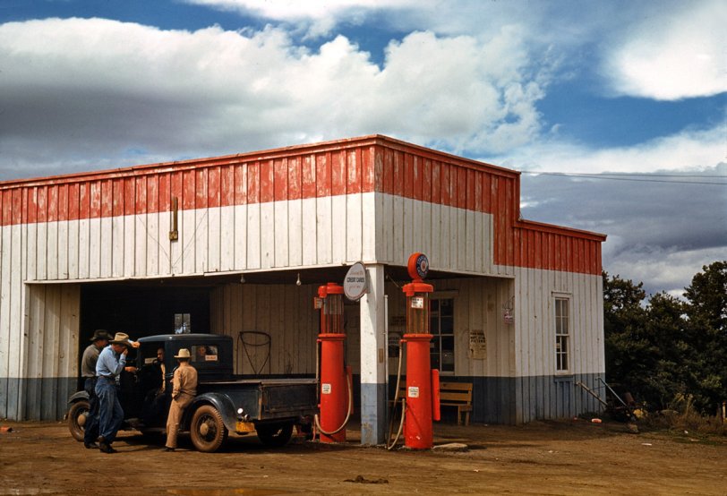 Filling station and garage at Pie Town, New Mexico. Photograph by Russell Lee. September 1940.  View full size. "Original owner sold pies, hence the name 'Pie Town.'" Wikipedia says that person was Clyde Norman, who started a dehydrated apple business there in the 1920s. Pie Town hosts a Pie Festival in the fall; photographer Lee took dozens of pictures of the 1940 rodeo and barbecue, which we'll be posting. Here we can see details of the the 1940 fair, and that gas was 21 cents a gallon. (Goodbye everyone, I'm moving to Pie Town - Dave)
