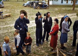 September 1940. "Saying grace before the barbeque dinner at the Pie Town, New Mexico Fair." View full size. 35mm Kodachrome transparency by Russell Lee.