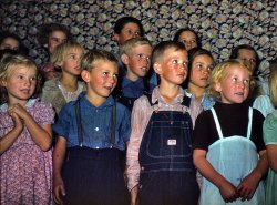October 1940. Pie Town schoolchildren in a community musical program. 35mm Kodachrome transparency by Russell Lee. View full size. Another view is here.