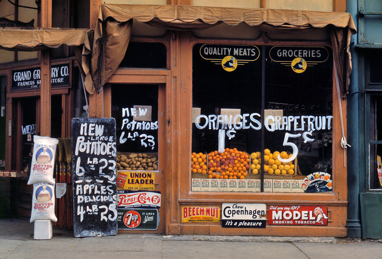 1942. Grand Grocery in Lincoln, Nebraska. View full size. 35mm Kodachrome transparency by John Vachon. Alternate version shows a different view.