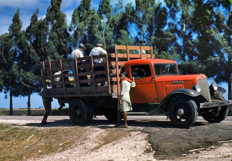 Photo of: The Red Truck: 1940 -- Field workers in Mississippi circa 1940. View full size. 35mm color transparency by Marion Post Wolcott for the Farm Security Administration.