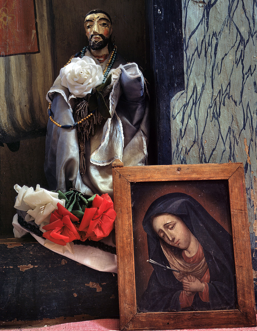 Spring 1943. Trampas, New Mexico. "A Santo bulto and a painting of the Dolorosa in the church." View full size. 4x5 Kodachrome transparency by John Collier.