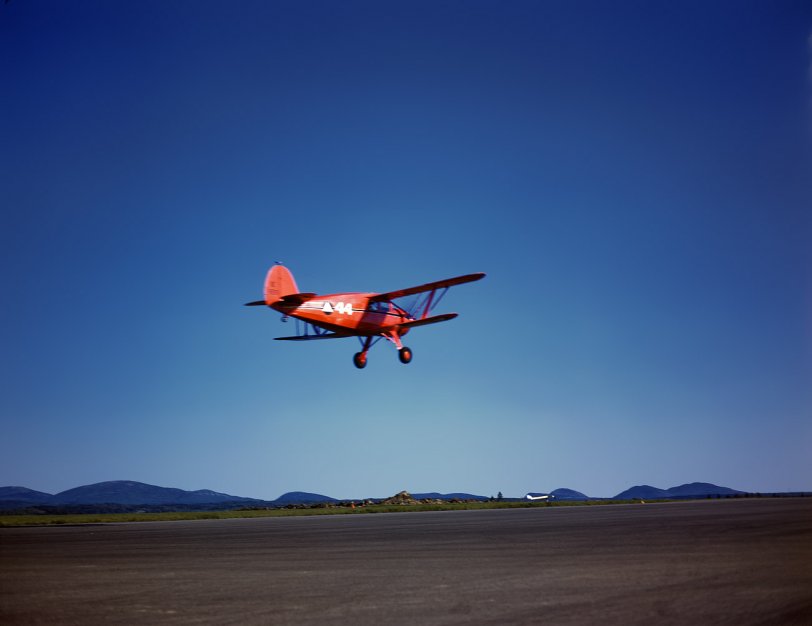 June 1942. Bar Harbor, Maine. Plane of Coast Patrol #20 at the Civil Air Patrol base. View full size. 4x5 Kodachrome transparency by John Collier.
