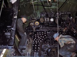 Working on the cab of a locomotive brought in for repairs at the Chicago & North Western 40th Street shops, Chicago. December 1942.  View full size. 4x5 Kodachrome transparency by Jack Delano.