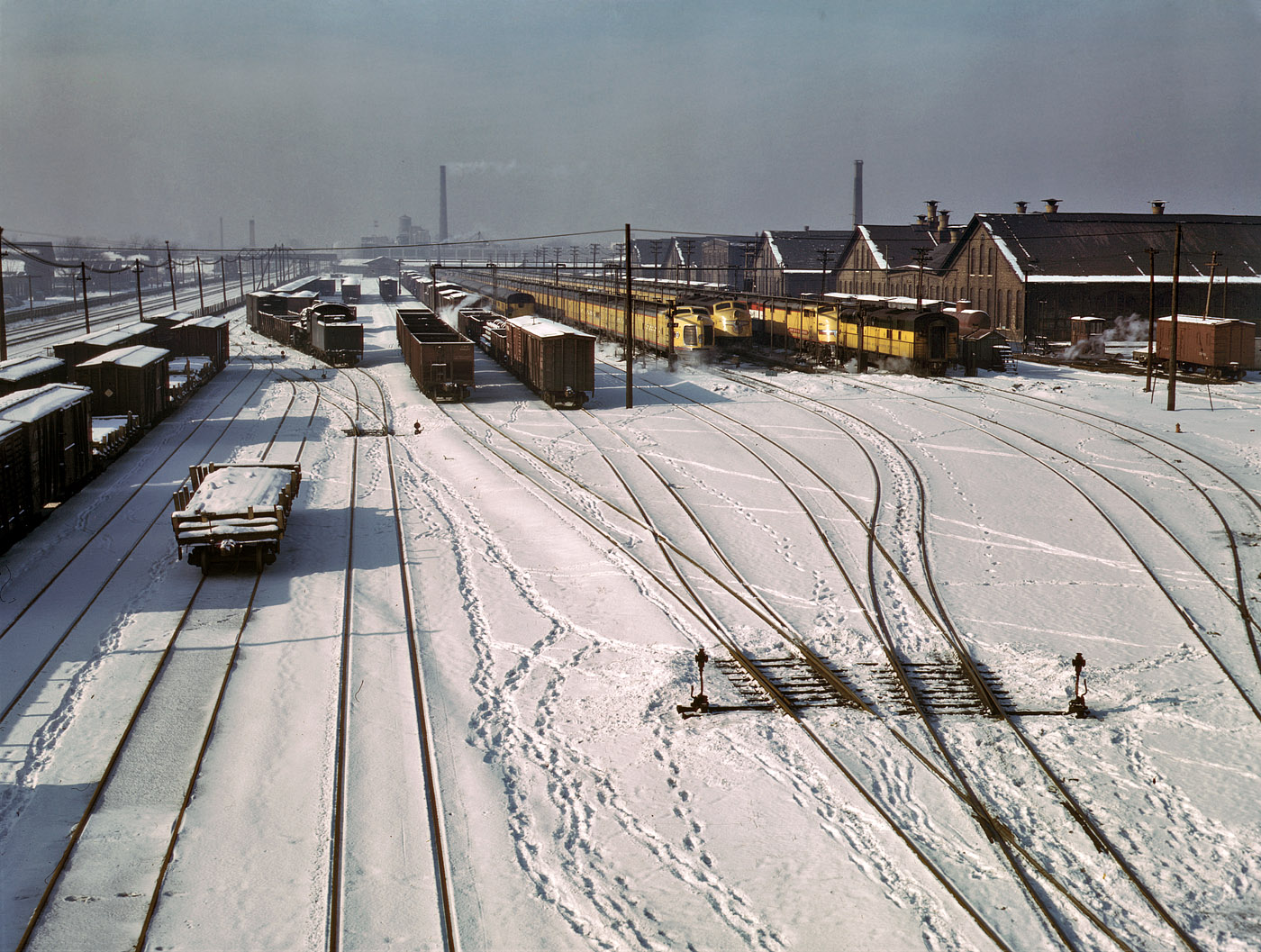 December 1942. Three West Coast streamliners in the Chicago & North Western yards at Chicago. View full size. 4x5 Kodachrome transparency by Jack Delano.