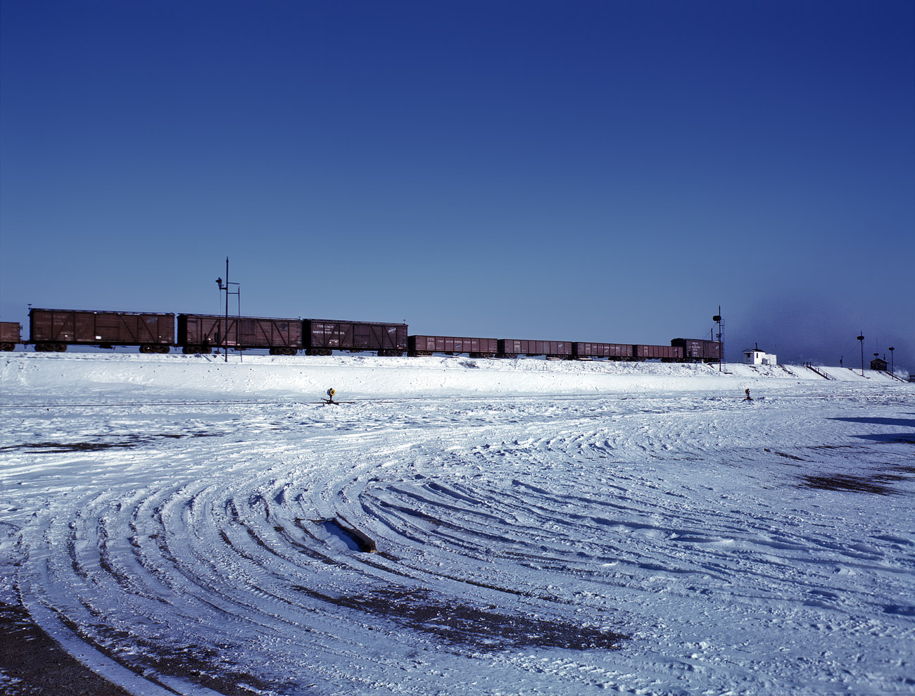 December 1942. Train going over the hump at the Chicago & North Western Proviso Yard. View full size. 4x5 Kodachrome transparency by Jack Delano.