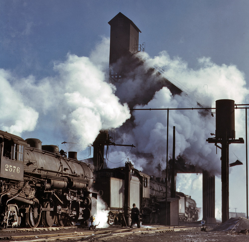 December 1942. Locomotives over the ash pit at the roundhouse and coaling station of the Chicago & North Western Railroad yards. View full size. 4x5 Kodachrome transparency by Jack Delano, Office of War Information.