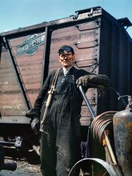 Chicago, April 1943. "Mike Evans, a welder, at the rip tracks of the Proviso Yard, Chicago & North Western R.R." 4x5 Kodachrome transparency by Jack Delano for the Office of War Information. View full size.