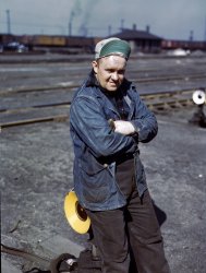 April 1943. A.S. Gerdee of 3251 Maypole Street, Chicago, a switchman at the Proviso Yard of the Chicago & North Western Railroad. View full size. 4x5 Kodachrome transparency by Jack Delano, Office of War Information.