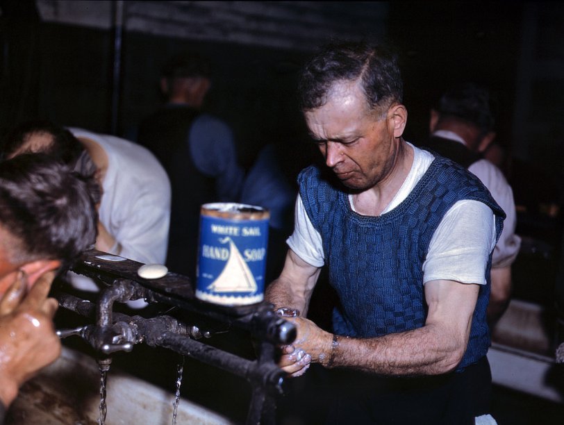 April 1943. Proviso Yards of the Chicago &amp; North Western Railroad. Joseph Klesken washing up after a day's work on the rip tracks. View full size. 4x5 Kodachrome transparency by Jack Delano for the Office of War Information.
