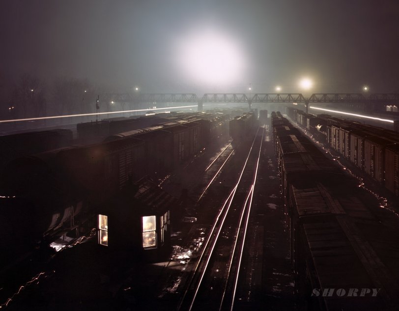 March 1943. The Santa Fe Yards at Argentine, Kansas. View full size. 4x5 Kodachrome transparency by Jack Delano, Office of War Information.
