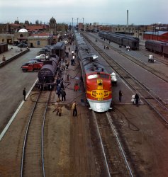 March 1943. "Santa Fe streamliner Super Chief being serviced at the depot in Albuquerque. Servicing these Diesel streamliners takes five minutes." 4x5 Kodachrome transparency by Jack Delano for the OWI. View full size.