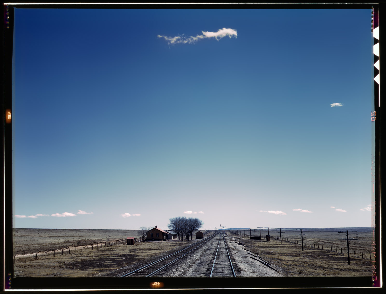 Santa Fe R.R. trip, March 1943. Section house along the Atchison, Topeka & Santa Fe Railroad in the vicinity of Encino, New Mexico. View full size. 4x5 Kodachrome transparency by Jack Delano for the Office of War Information.