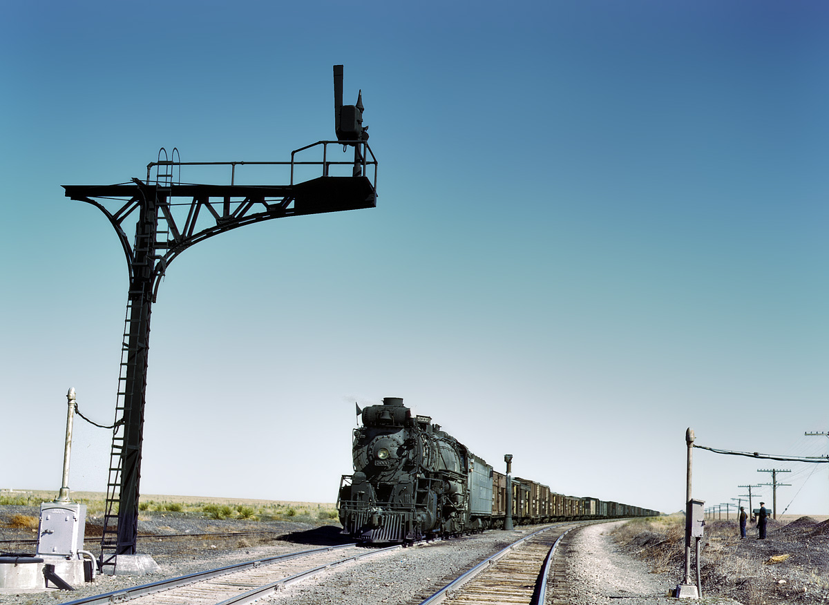 March 1943. Westbound Santa Fe freight on a siding at Ricardo, New Mexico, waiting for the eastbound train to pass. View full size. 4x5 Kodachrome transparency by Jack Delano. FSA/Office of War Information archive.