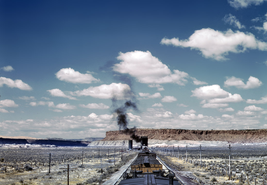 Santa Fe R.R. train stopping for coal and water at Laguna, New Mexico. March 1943.  View full size. 4x5 Kodachrome transparency by Jack Delano.