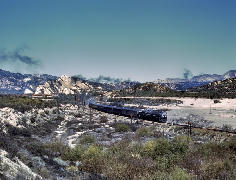 March 1943. Santa Fe trip from Chicago to California. Trains on the Santa Fe tracks through Cajon Pass in the San Bernardino Mountains. View full size. 4x5 Kodachrome transparency by Jack Delano for the Office of War Information.
