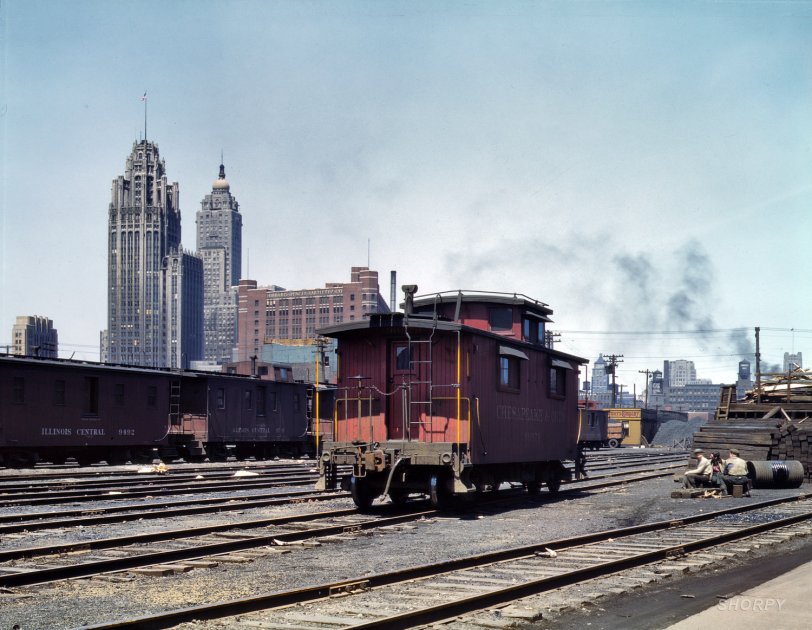 Chicago, April 1943. "General view of part of the South Water street freight depot of the Illinois Central Railroad. Chesapeake &amp; Ohio R.R. caboose." 4x5 Kodachrome transparency by Jack Delano for the OWI. View full size.
