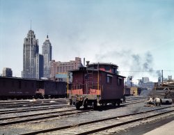 Chicago, April 1943. "General view of part of the South Water street freight depot of the Illinois Central Railroad. Chesapeake & Ohio R.R. caboose." 4x5 Kodachrome transparency by Jack Delano for the OWI. View full size.
