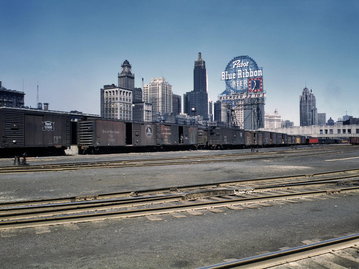 April 1943. South Water Street freight depot of the Illinois Central Railroad at Chicago. View full size. 4x5 Kodachrome transparency by Jack Delano.