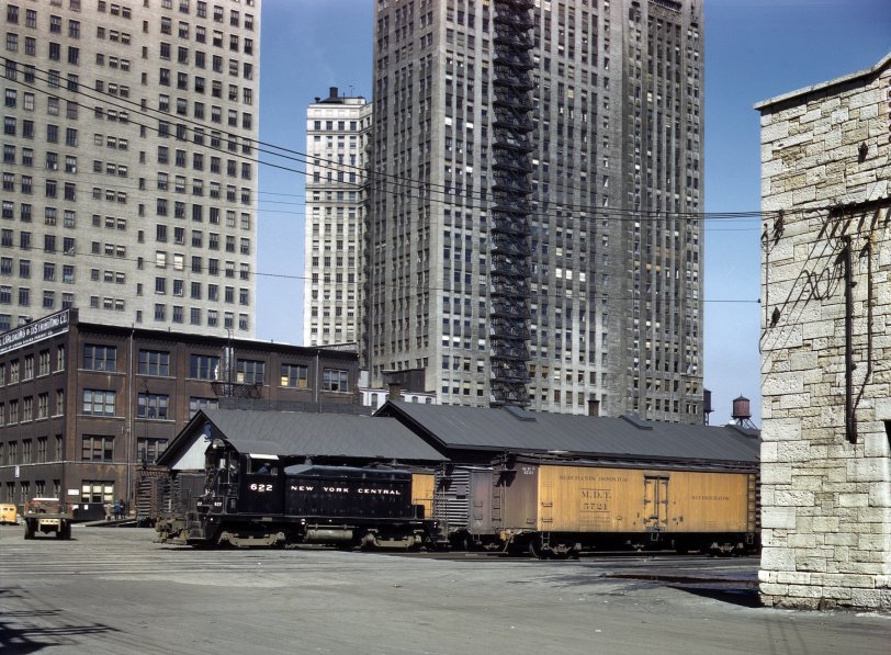 Chicago, April 1943. "New York Central diesel switch engine moving freight cars at the South Water Street terminal of the Illinois Central R.R." View full size. 4x5 Kodachrome transparency by Jack Delano for the Office of War Information.
