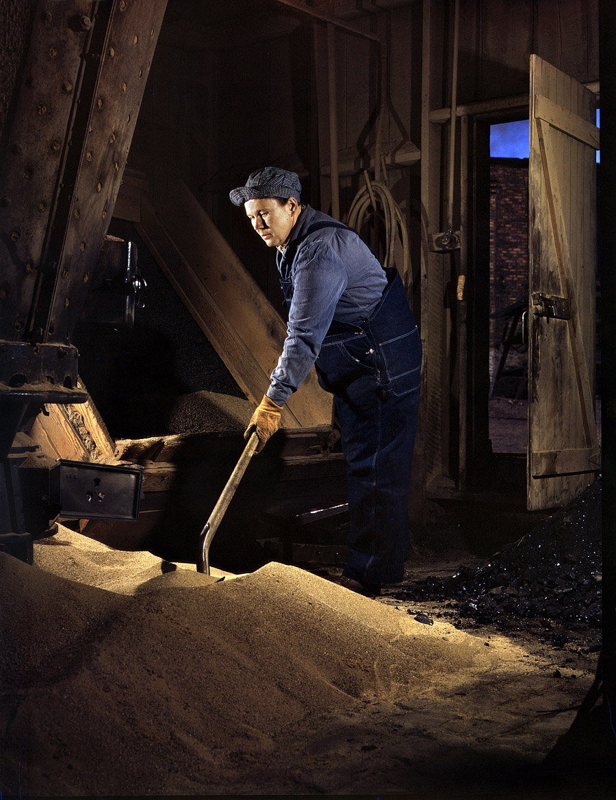 April 1943. "Mrs. Thelma Cuvage, working in the sand house at the Chicago & North Western R.R. roundhouse at Clinton, Iowa. Her job is to see that sand is sifted and cleaned for use in the locomotives. Mrs. Cuvage's husband works as a guard at the Savanna, Illinois, ordnance plant." 4x5 Kodachrome transparency by Jack Delano for the Office of War Information. View full size.