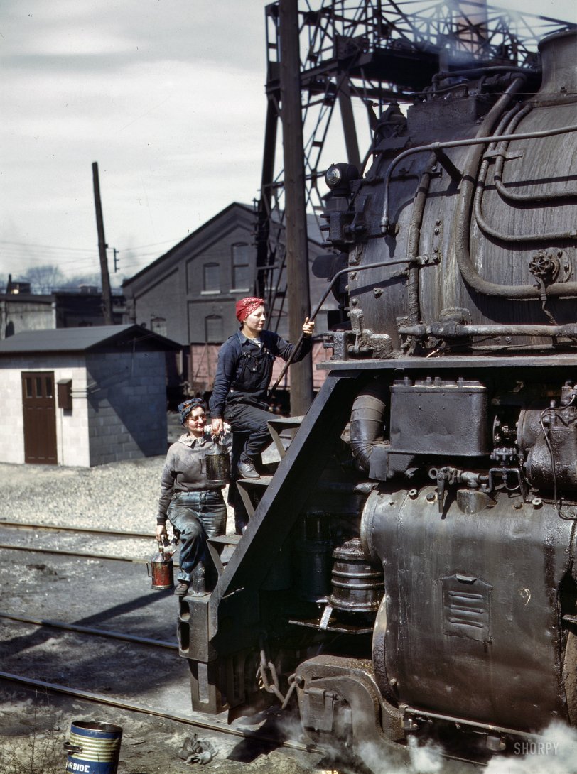 April 1943. Clinton, Iowa. "Marcella Hart and Viola Sievers, wipers for the Chicago &amp; North Western Railroad, cleaning one of the giant H-class locomotives." 4x5 Kodachrome transparency by Jack Delano. View full size.